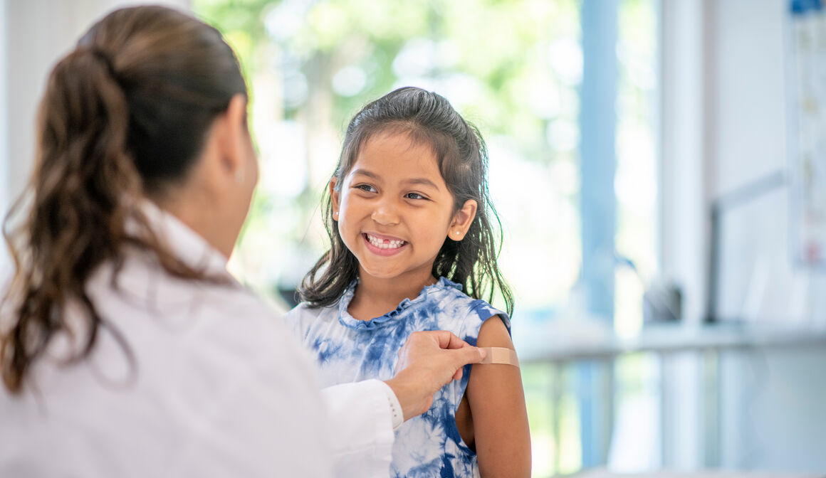 smiling-girl-being-vaccinated