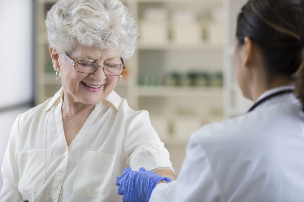elderly lady being vaccinated
